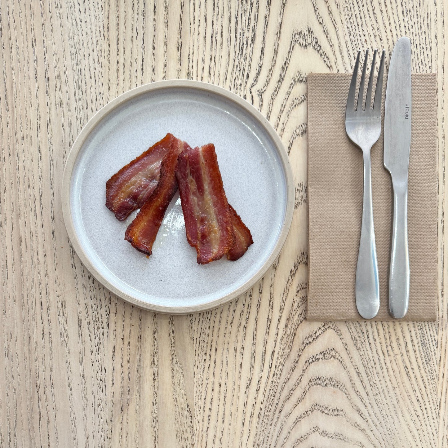 A side of bacon on a plate at the Heath Street Bakehouse