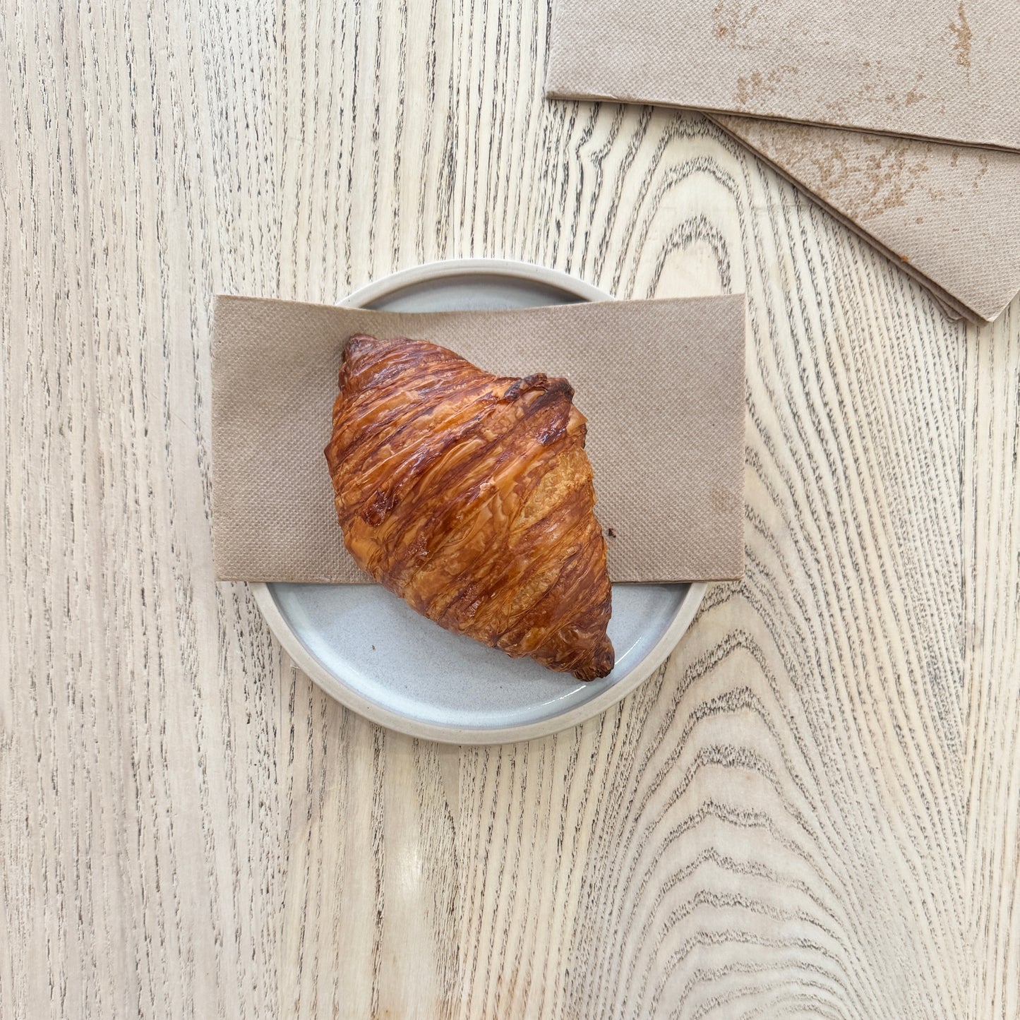 A Croissant on a plate at the Heath Street Bakehouse